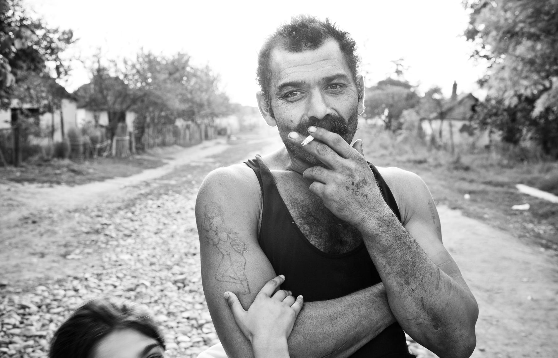 Black and white portrait of a man pausing in thought
