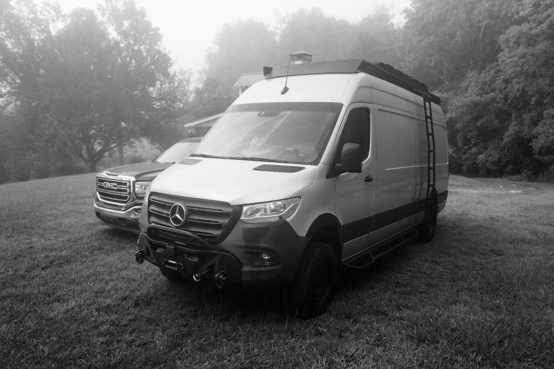 Whisper Sprinter production van parked in morning fog